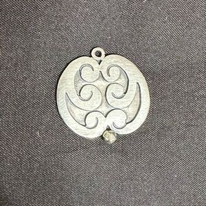 Vintage Silver Oval Pendant with raised swirl designs